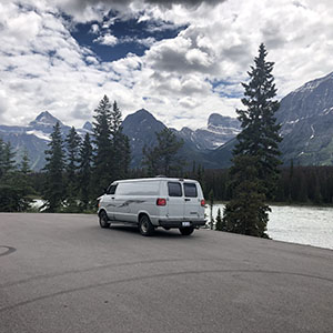White van with mountains in background